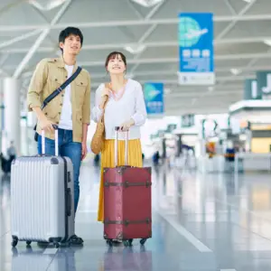 Travelers with luggage using a reliable airport taxi service in Hubli for smooth airport transfers.